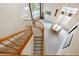 Elevated view of a living room and a staircase with wood banisters at 13560 Detroit St, Thornton, CO 80241