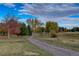 Autumn landscape with paved pathway and colorful trees at 4618 S Newton St, Denver, CO 80236