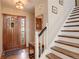 Bright entryway with hardwood floors, wooden door and staircase at 4618 S Newton St, Denver, CO 80236