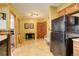 View of kitchen and adjacent hallway with tile floor at 4618 S Newton St, Denver, CO 80236