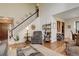 Living room with hardwood floors, fireplace and a view to the entryway at 4618 S Newton St, Denver, CO 80236