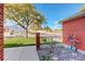 Brick patio with a white bicycle and garden decorations at 4618 S Newton St, Denver, CO 80236