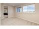 Bright bedroom with large windows and plush carpeting at 8596 Hotchkiss St, Littleton, CO 80125