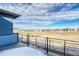 Deck view showing the community, distant mountain and plains view at 8596 Hotchkiss St, Littleton, CO 80125