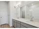 Modern bathroom with double vanity, large mirror, and a walk-in shower at 487 Interlocken Blvd # 407, Broomfield, CO 80021