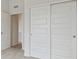 White sliding door closet with additional access to hallway at 487 Interlocken Blvd # 407, Broomfield, CO 80021