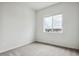 Bright bedroom with carpet flooring and large window with a view at 487 Interlocken Blvd # 407, Broomfield, CO 80021