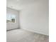 Spacious bedroom with neutral carpeting and large window at 487 Interlocken Blvd # 407, Broomfield, CO 80021
