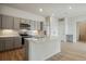 Modern kitchen with island and stainless steel appliances at 487 Interlocken Blvd # 407, Broomfield, CO 80021