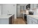Modern kitchen with gray cabinets and stainless steel appliances at 487 Interlocken Blvd # 407, Broomfield, CO 80021