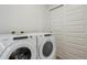Laundry room with Whirlpool washer and dryer, and storage at 487 Interlocken Blvd # 407, Broomfield, CO 80021