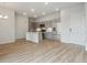 Open concept living and kitchen area with hardwood floors at 487 Interlocken Blvd # 407, Broomfield, CO 80021