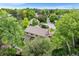 A beautiful single-Gathering home with a large yard and mature trees and pergola covered porch at 5185 W Fair Pl, Littleton, CO 80123