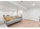 Finished basement featuring an open living area with wood-look floors and a neutral palette at 5185 W Fair Pl, Littleton, CO 80123