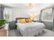 Bedroom with white walls, green trim, natural light and neutral decor at 5185 W Fair Pl, Littleton, CO 80123