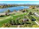 Expansive aerial view featuring Sloan's Lake with the city skyline and distant mountains in the background on a clear day at 1901 Meade St, Denver, CO 80204