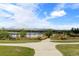 Peaceful view of a lakeside walking path with a bench, showcasing a serene setting under a cloudy sky at 1901 Meade St, Denver, CO 80204
