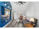 Cozy living room with gray sofa, accent chair, and ceiling fan at 7825 S Marshall St, Littleton, CO 80128