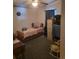 Modest bedroom with bed, storage, and view of a desk area at 313 W 3Rd Ave, Byers, CO 80103