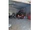 Spacious detached garage interior featuring gravel flooring and metal ceiling at 313 W 3Rd Ave, Byers, CO 80103