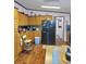 Traditional kitchen with wood cabinets, black refrigerator, and light-colored countertops at 313 W 3Rd Ave, Byers, CO 80103