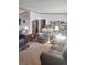 Living room with plush furniture, bookshelves, and carpet at 313 W 3Rd Ave, Byers, CO 80103
