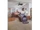 Open floor plan with living room and dining area featuring a leather armchair at 313 W 3Rd Ave, Byers, CO 80103