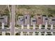 Drone's eye view of homes with solar panels, manicured lawns, and a well-planned neighborhood layout at 18922 W 84Th Ave, Arvada, CO 80007