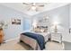 Bedroom boasts a ceiling fan, soft carpet, neutral walls, and natural light at 18922 W 84Th Ave, Arvada, CO 80007
