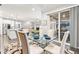 Dining room flows into the kitchen and living room with views to the exterior patio at 18922 W 84Th Ave, Arvada, CO 80007