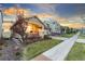 Attractive home exterior showcasing a covered porch and lush landscaping in a serene setting at 18922 W 84Th Ave, Arvada, CO 80007