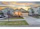 Inviting single-Gathering home featuring a charming front porch and well-maintained landscaping at 18922 W 84Th Ave, Arvada, CO 80007