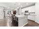 Spacious kitchen island with granite countertops and pendant lighting overlooking the dining area at 18922 W 84Th Ave, Arvada, CO 80007