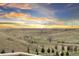 Expansive landscape view overlooking the neighborhood and featuring rolling hills at 18922 W 84Th Ave, Arvada, CO 80007