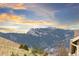 Picturesque landscape view featuring a mountain range and lush foliage in a rural setting at 18922 W 84Th Ave, Arvada, CO 80007
