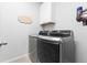 Well-equipped laundry room featuring modern, front-loading washer and dryer for efficient laundry care at 18922 W 84Th Ave, Arvada, CO 80007
