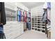 Organized walk-in closet with custom shelving and storage solutions for all your wardrobe needs at 18922 W 84Th Ave, Arvada, CO 80007