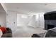 Spacious basement area with a decorative fireplace and ample room for activities at 2995 N Cherry St, Denver, CO 80207