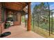 Cozy back porch with comfortable seating and a protective fence, offering stunning views of the surrounding nature at 7790 S Homesteader Dr, Morrison, CO 80465