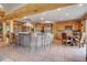 Spacious kitchen with large island, stainless steel appliances, breakfast nook, and custom tile flooring at 7790 S Homesteader Dr, Morrison, CO 80465