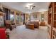 Spacious main bedroom with a private balcony, wooden furniture, and natural light at 7790 S Homesteader Dr, Morrison, CO 80465