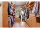 Large walk-in closet featuring built-in shelving, drawers, and ample storage space at 7790 S Homesteader Dr, Morrison, CO 80465