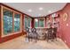 Wet bar with stone counter, unique chairs, and windows offering views of the surrounding landscape at 7790 S Homesteader Dr, Morrison, CO 80465