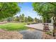 Great backyard featuring a well-maintained lawn, mature trees, a patio, and decorative landscaping at 10546 Sundial Rim Rd, Highlands Ranch, CO 80126