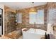 Luxurious bathroom featuring a standalone tub, glass-enclosed shower, and elegant tile work, creating a spa-like experience at 10546 Sundial Rim Rd, Highlands Ranch, CO 80126