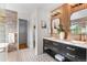 Bathroom featuring double sink vanity with marble countertops and stylish tile floors at 10546 Sundial Rim Rd, Highlands Ranch, CO 80126