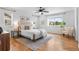 Bright bedroom with neutral tones, large windows, and modern decor at 10546 Sundial Rim Rd, Highlands Ranch, CO 80126