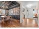 Formal dining room featuring elegant chandelier, wainscoting, and designer wallpaper at 10546 Sundial Rim Rd, Highlands Ranch, CO 80126