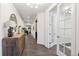 Inviting hallway with hardwood floors, stylish console table, and French doors leading to other rooms in the home at 10546 Sundial Rim Rd, Highlands Ranch, CO 80126