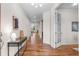 Entryway featuring hardwood floors and neutral tones, leading to various rooms in the home at 10546 Sundial Rim Rd, Highlands Ranch, CO 80126